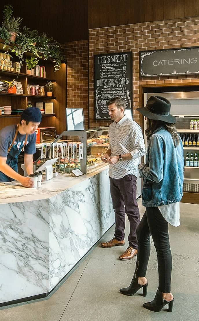 People ordering at cafe